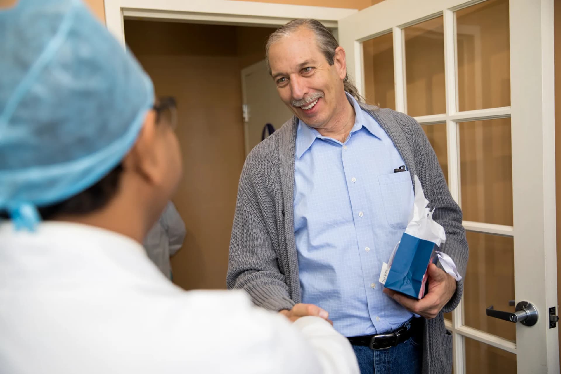 Dental team member explaining financing options to patient