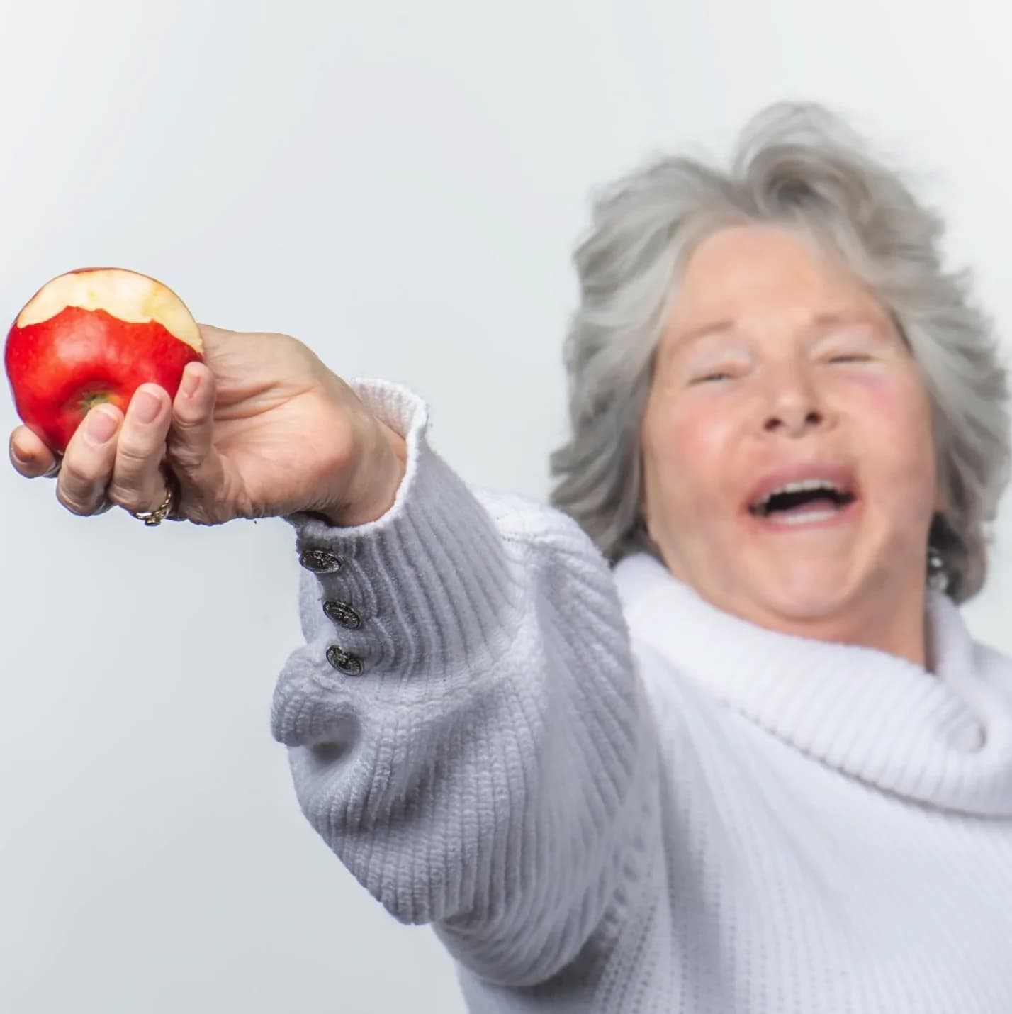 Patient smiling after full mouth reconstruction with dental implants