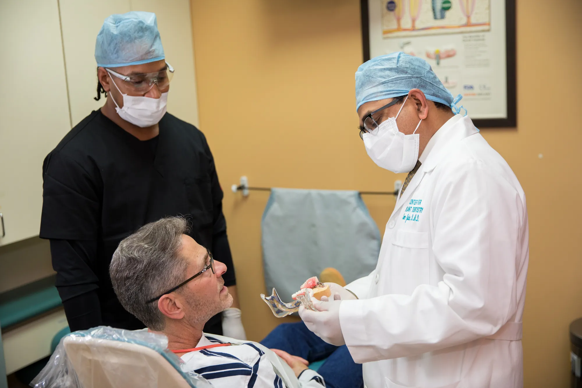 Implant surgeons and engineers collaborating